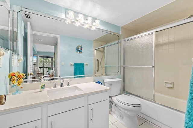 full bathroom with vanity, tile patterned floors, shower / bath combination with glass door, and toilet