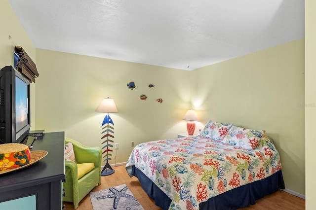 bedroom featuring hardwood / wood-style flooring