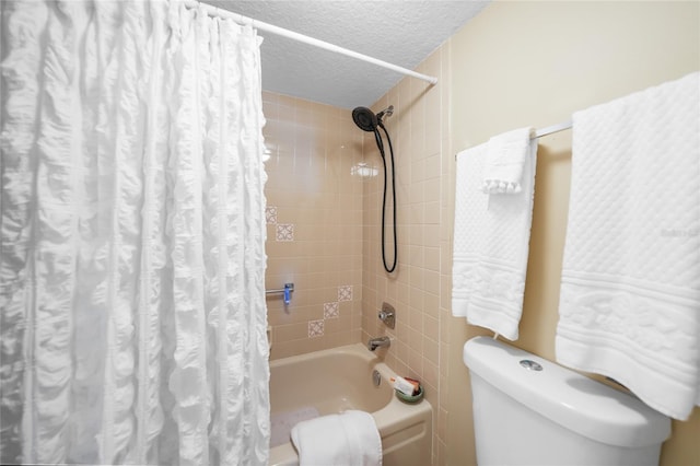 bathroom featuring shower / tub combo, toilet, and a textured ceiling