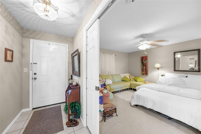 interior space featuring light tile patterned flooring and ceiling fan