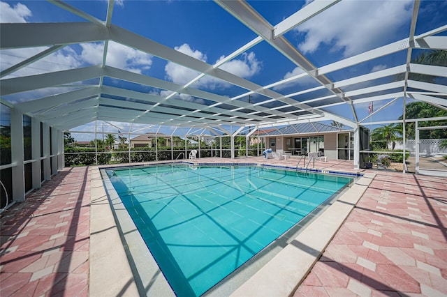 view of pool featuring a patio and a lanai