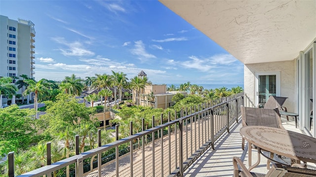 balcony featuring a water view