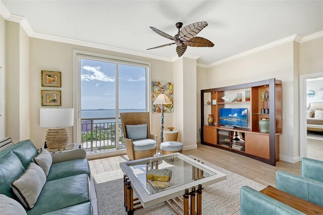 living room with crown molding, light wood-type flooring, and ceiling fan