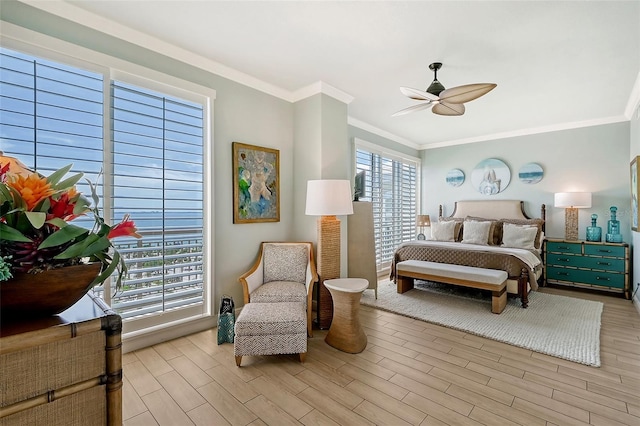 bedroom with light hardwood / wood-style flooring, crown molding, and ceiling fan