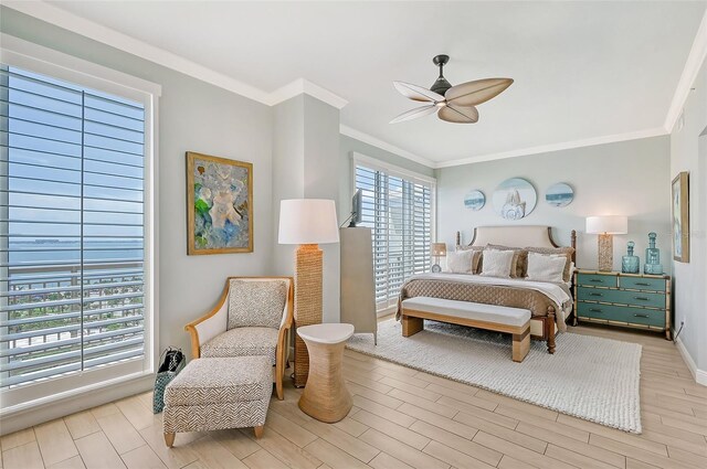 bedroom with ceiling fan, light hardwood / wood-style flooring, and ornamental molding