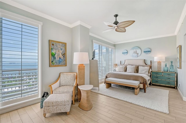 bedroom featuring crown molding, ceiling fan, and light wood-type flooring