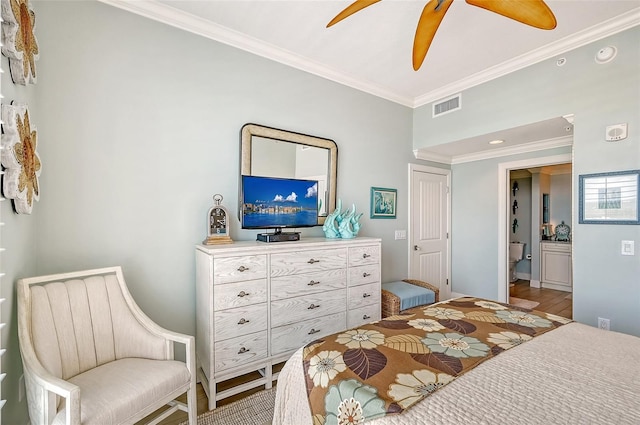 bedroom featuring ornamental molding, ceiling fan, and hardwood / wood-style flooring