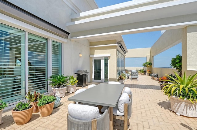 view of patio / terrace with area for grilling and french doors