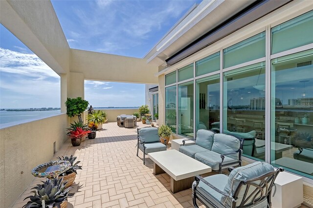 view of patio / terrace featuring a water view