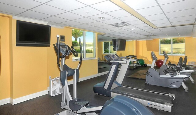 exercise room featuring a drop ceiling