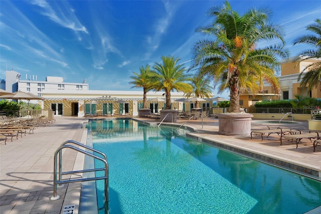 view of pool with a patio and a pergola