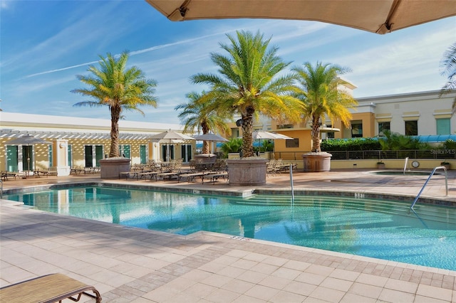 view of swimming pool featuring a patio