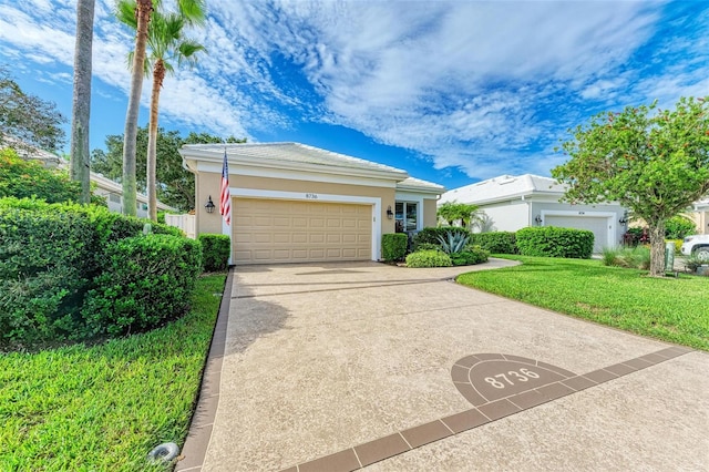 view of front of home with a garage and a front yard