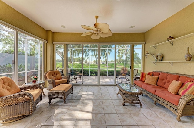 sunroom featuring ceiling fan