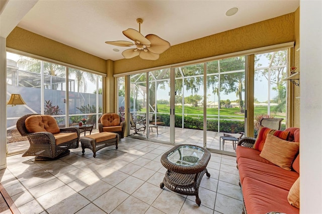 sunroom / solarium with a wealth of natural light and ceiling fan