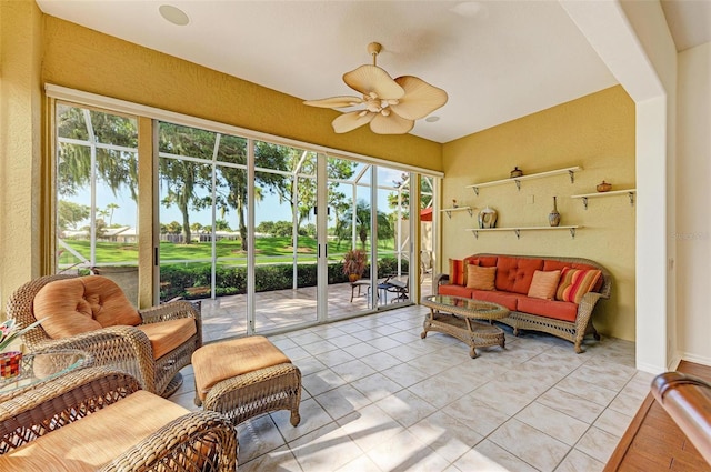 sunroom featuring ceiling fan