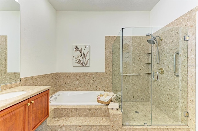 bathroom featuring vanity and shower with separate bathtub