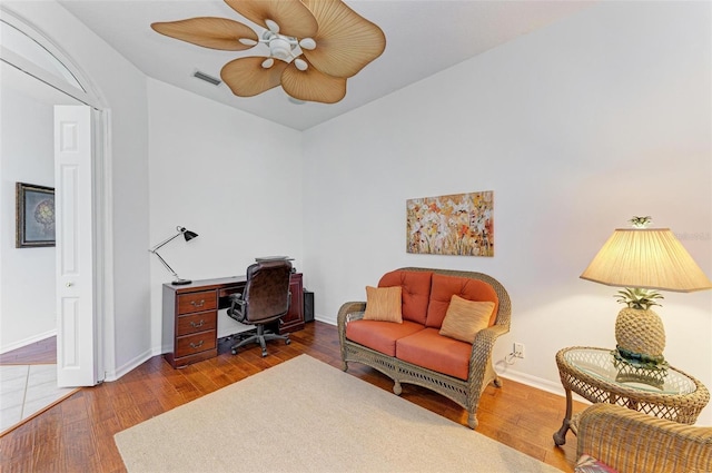 office with ceiling fan and hardwood / wood-style floors