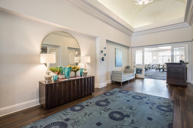 interior space with crown molding and dark hardwood / wood-style floors