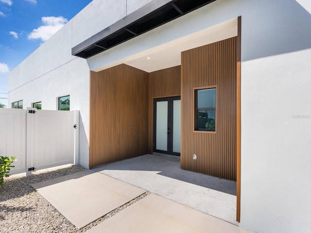 property entrance featuring a patio area