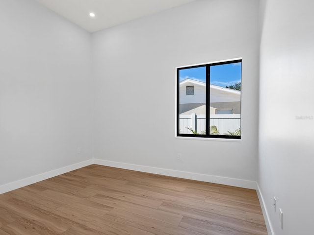 spare room featuring light hardwood / wood-style floors