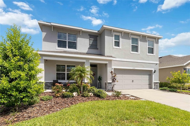 view of front of house featuring a front yard and a garage