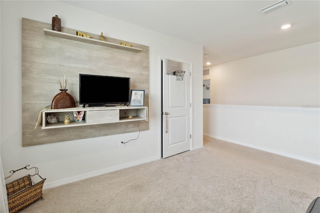 unfurnished living room featuring carpet