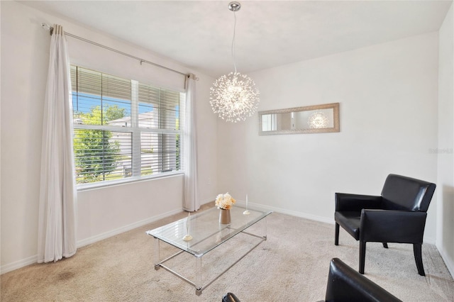 sitting room with light carpet and a chandelier