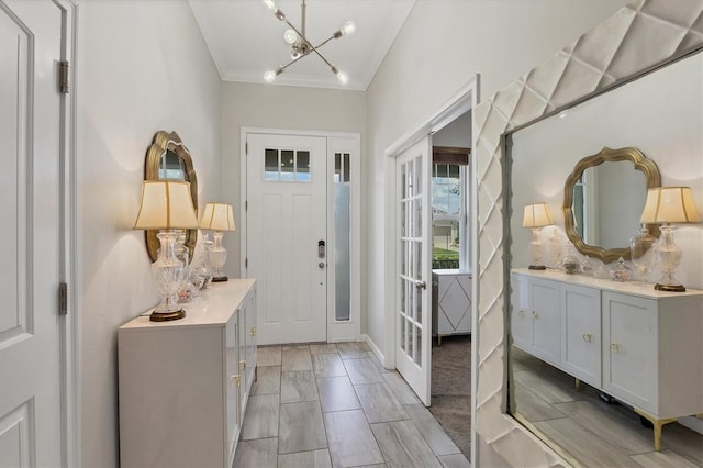 entryway featuring an inviting chandelier and lofted ceiling