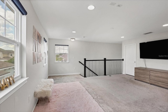 living area featuring light colored carpet