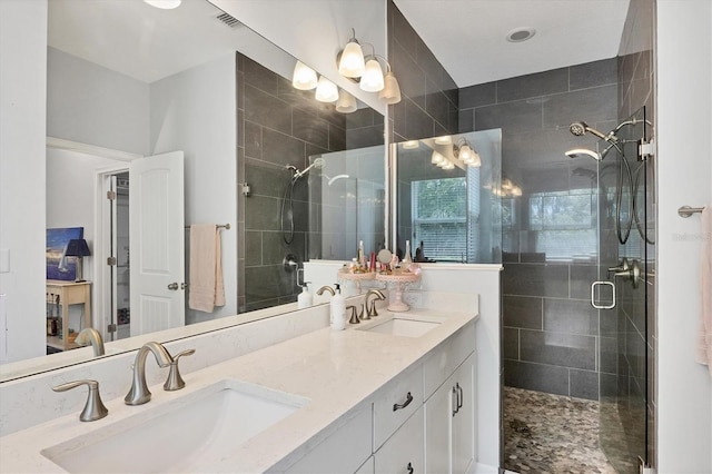 bathroom with an enclosed shower and vanity