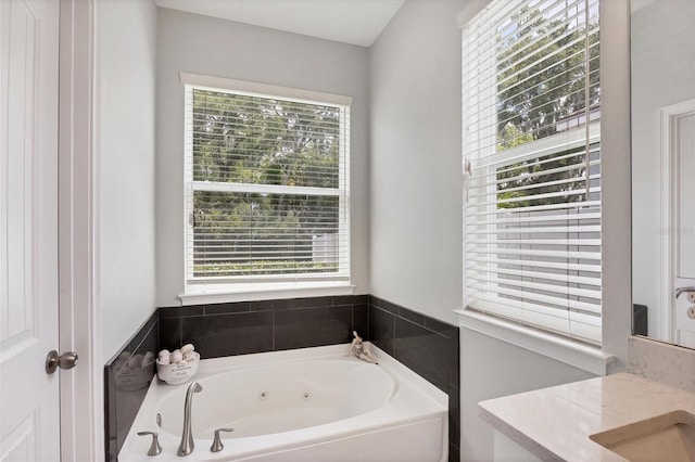 bathroom with vanity and a bathing tub