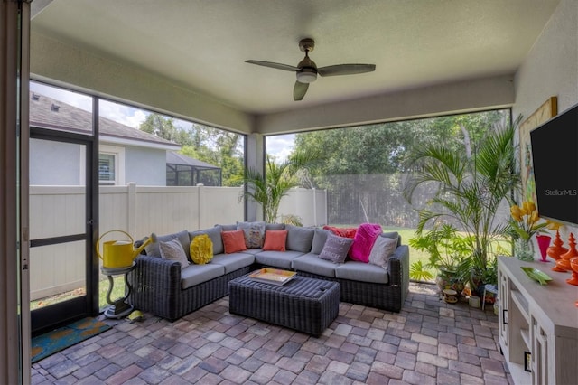 sunroom / solarium with ceiling fan