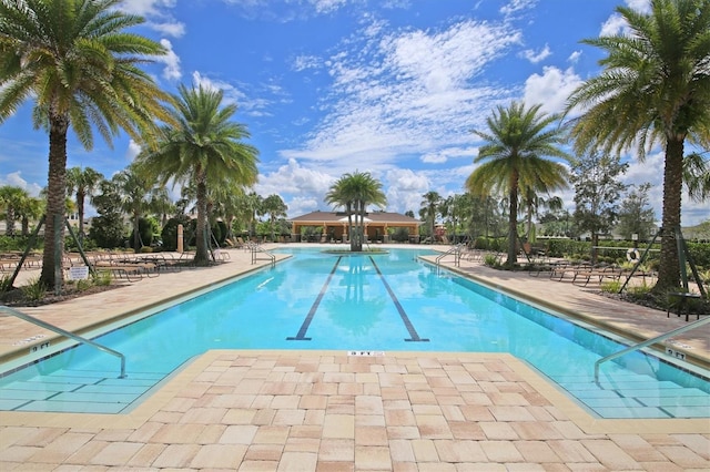 view of swimming pool featuring a patio area