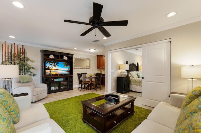 living room featuring ornamental molding and ceiling fan