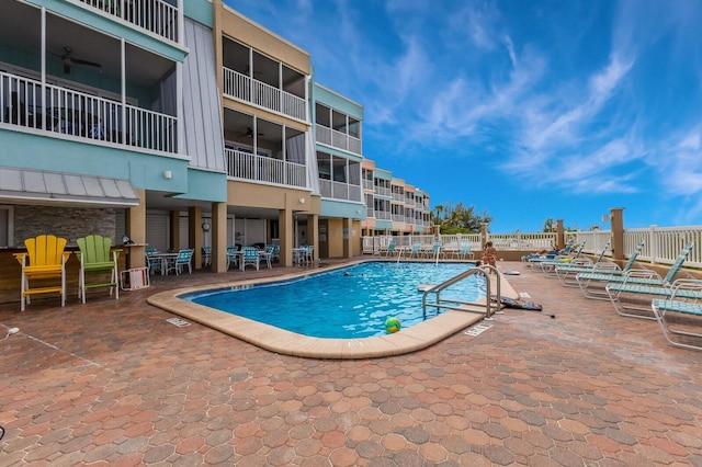 view of pool featuring a patio