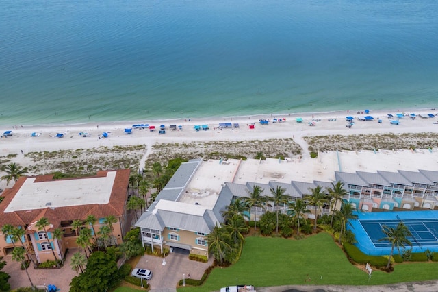 bird's eye view with a water view and a view of the beach