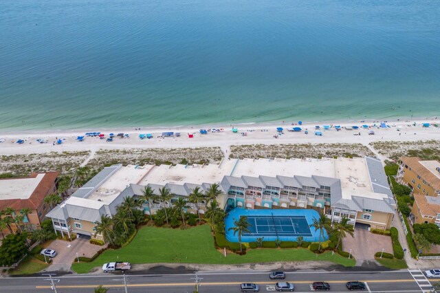 aerial view with a water view and a beach view