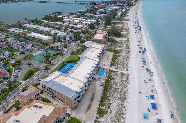 birds eye view of property featuring a view of the beach and a water view