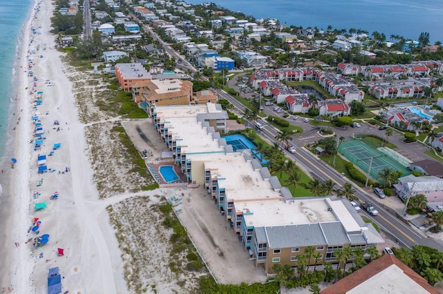 birds eye view of property featuring a water view and a view of the beach