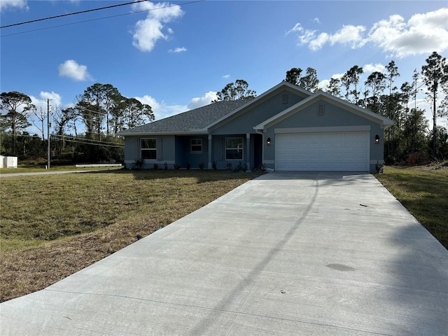 view of front of house with a front lawn and a garage