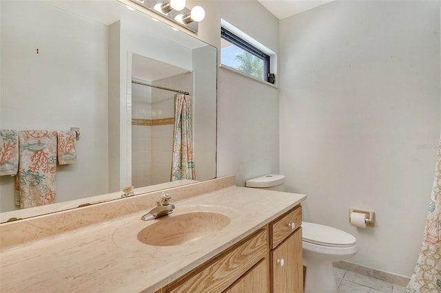 bathroom with vanity, toilet, curtained shower, and tile patterned flooring