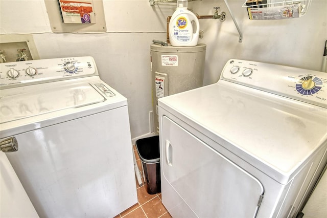 washroom with light tile patterned flooring and washing machine and clothes dryer