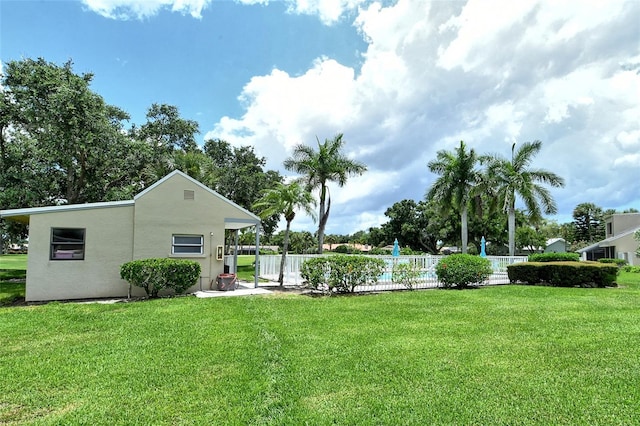 view of yard featuring a fenced in pool