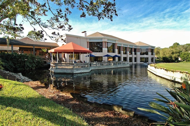 exterior space featuring a gazebo and a water view