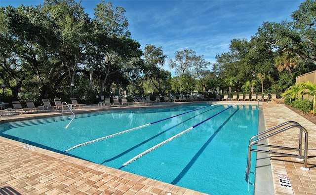 view of swimming pool with a patio area