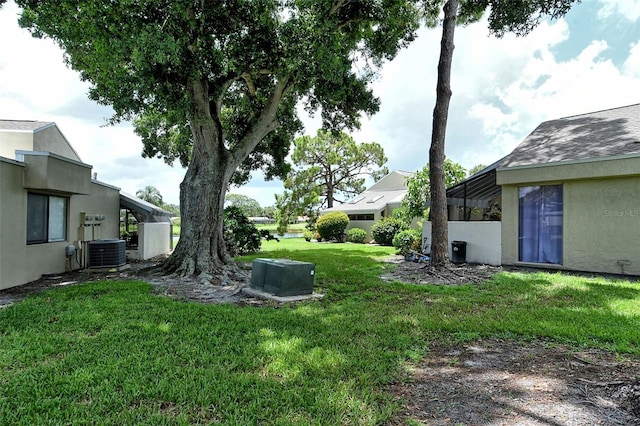 view of yard featuring central air condition unit