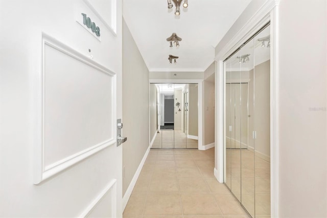 hall with light tile patterned floors