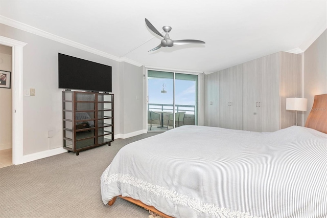 carpeted bedroom featuring expansive windows, ornamental molding, access to exterior, and ceiling fan