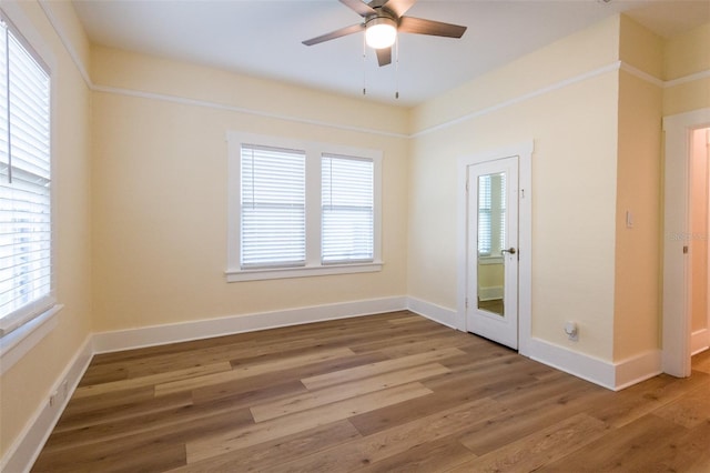 unfurnished room with wood-type flooring and ceiling fan